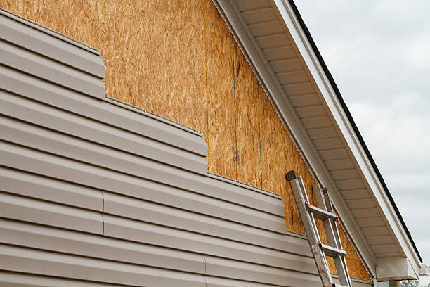 Professional Storm Damage Siding Repair technician working in Englewood, OH